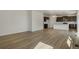 Open living room with light hardwood floors and ample natural light at 8378 E 132Nd Pl, Thornton, CO 80602