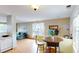 Small dining area with table and chairs, adjacent to kitchen and living room at 762 Mockingbird Ln, Brighton, CO 80601