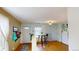 Home entryway with small table and bench seating, and view into living room at 762 Mockingbird Ln, Brighton, CO 80601