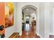 Bright entryway with hardwood floors and art at 6988 S Riverwood Way, Aurora, CO 80016