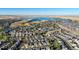 Aerial view of houses and a lake in a residential area at 6988 S Riverwood Way, Aurora, CO 80016