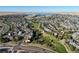 Aerial view of a large community with a lake at 6988 S Riverwood Way, Aurora, CO 80016