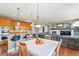 Kitchen with hardwood floors, island, and breakfast nook at 6988 S Riverwood Way, Aurora, CO 80016