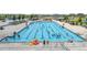 Community lap pool with surrounding lounge chairs at 6988 S Riverwood Way, Aurora, CO 80016