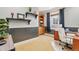 Home office with built-in shelves and window at 6988 S Riverwood Way, Aurora, CO 80016