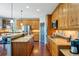 Modern kitchen with granite countertops and wood cabinets at 6988 S Riverwood Way, Aurora, CO 80016