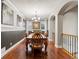 Elegant dining room features hardwood floors, a large table, and a chandelier at 6988 S Riverwood Way, Aurora, CO 80016