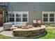 Outdoor patio with fire pit, seating area and spiral staircase at 6988 S Riverwood Way, Aurora, CO 80016
