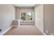Well-lit bedroom with double door closet and carpet flooring at 6988 S Riverwood Way, Aurora, CO 80016