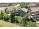 Aerial view of house, backyard, firepit, and surrounding homes at 6988 S Riverwood Way, Aurora, CO 80016