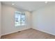 Bright and airy home office with large window and hardwood floors at 5918 Red Barn Ave, Mead, CO 80504