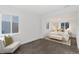 Bright bedroom with carpeted floor and a comfortable sitting area at 2749 S Glencoe St, Denver, CO 80222