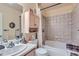 Clean bathroom with a tub, shower, and vanity with a large mirror at 1878 S Cole St, Lakewood, CO 80228