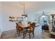 Small dining area with a wooden table and four chairs at 1878 S Cole St, Lakewood, CO 80228