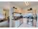 Kitchen with light wood cabinets, granite counters, and stainless steel appliances at 1878 S Cole St, Lakewood, CO 80228