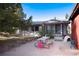 Home's backyard patio with picnic table and chairs at 3074 County Road 166, Elizabeth, CO 80107