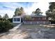 Ranch style home with brick exterior, a fenced yard, and a patio at 3074 County Road 166, Elizabeth, CO 80107