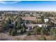 Aerial view of property showing house, outbuildings, and expansive land at 3074 County Road 166, Elizabeth, CO 80107