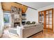 Living room with stone fireplace and hardwood floors at 2441 S Xanadu Way # D, Aurora, CO 80014