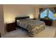 Spacious bedroom with a king-size bed and two nightstands at 2131 Ranch Dr, Denver, CO 80234