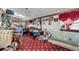 Game room with red carpet and eclectic decor at 4507 Josephine St, Denver, CO 80216
