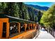 Passengers enjoy a scenic train ride through mountains at 2121 Hummingbird Way # 204, Georgetown, CO 80444