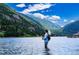 Fly fisherman casts line in mountain lake at 2121 Hummingbird Way # 204, Georgetown, CO 80444
