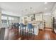 Bright and airy kitchen with white cabinets, breakfast bar seating, and ample counter space at 15658 W 95Th Ave, Arvada, CO 80007