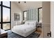 Bedroom with large windows and patterned wall at 800 Bonnie Brae Blvd, Denver, CO 80209