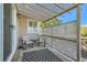 Relaxing patio with pergola, two rocking chairs, and a patterned rug at 10189 Adams St, Thornton, CO 80229