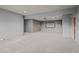 Spacious basement includes a projector screen setup for entertainment at 812 Willobe Way, Golden, CO 80401