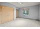 Cozy bedroom with double doors leading to the closet and a window at 812 Willobe Way, Golden, CO 80401