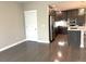 Bright dining area with hardwood floors and access to kitchen at 1179 S Sherman St, Denver, CO 80210