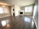 Bright living room with hardwood floors, fireplace, and plantation shutters at 1179 S Sherman St, Denver, CO 80210