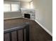 Living room with corner fireplace and large windows at 1179 S Sherman St, Denver, CO 80210