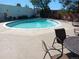 Inviting community pool with surrounding patio furniture at 4570 E Yale Ave # 706, Denver, CO 80222