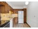 Functional kitchen with wood cabinets and appliances at 4570 E Yale Ave # 706, Denver, CO 80222