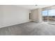 Spacious bedroom with balcony access and carpet at 4570 E Yale Ave # 706, Denver, CO 80222