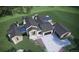 Luxury home with attached garage and landscaping; viewed from above at 7499 Preservation Trl, Parker, CO 80134