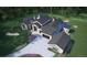 Luxury home with attached garage and landscaping; viewed from above at 7499 Preservation Trl, Parker, CO 80134