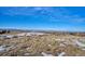 Aerial view of a residential lot with mountain views in the background at 7499 Preservation Trl, Parker, CO 80134