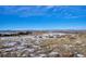 Aerial view of a residential lot with mountain views in the background at 7499 Preservation Trl, Parker, CO 80134