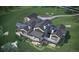 Bird's-eye view of a luxury home with a large backyard and attached garage at 7499 Preservation Trl, Parker, CO 80134