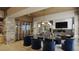 Elegant dining room with a wine wall and modern chandelier at 7499 Preservation Trl, Parker, CO 80134