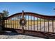 Iron gate entrance with views of the surrounding landscape at 7499 Preservation Trl, Parker, CO 80134
