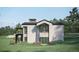 Luxury home with stone and stucco exterior, featuring a balcony and patio at 7499 Preservation Trl, Parker, CO 80134