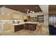 Open concept kitchen features a large island, custom cabinetry, and top-of-the-line appliances at 7499 Preservation Trl, Parker, CO 80134