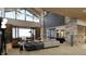 Spacious living room with soaring ceilings, large windows, and stunning mountain views at 7499 Preservation Trl, Parker, CO 80134