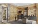 Elegant home office with built-in shelving, large desk, and ample natural light at 7499 Preservation Trl, Parker, CO 80134
