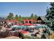 Expansive pool area with numerous red umbrellas and hot tubs at 7499 Preservation Trl, Parker, CO 80134